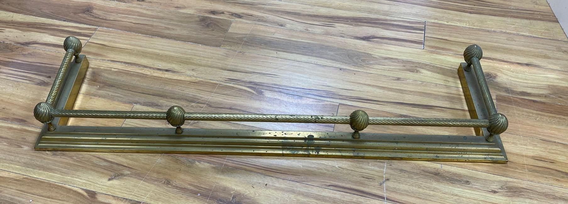 A Victorian brass kerb, length 133cm